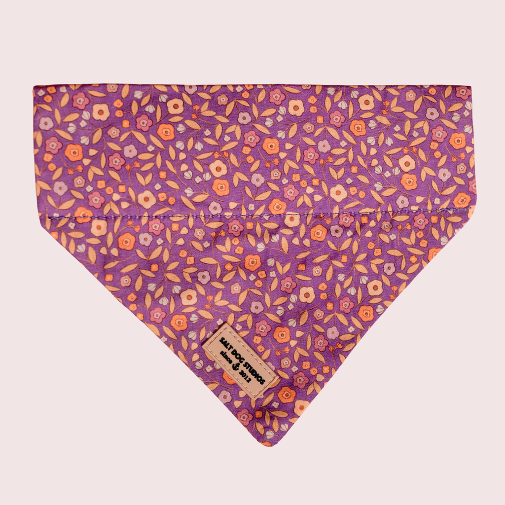 Ditsy Floral Purple dog bandana with small flowers on purple, shown flat