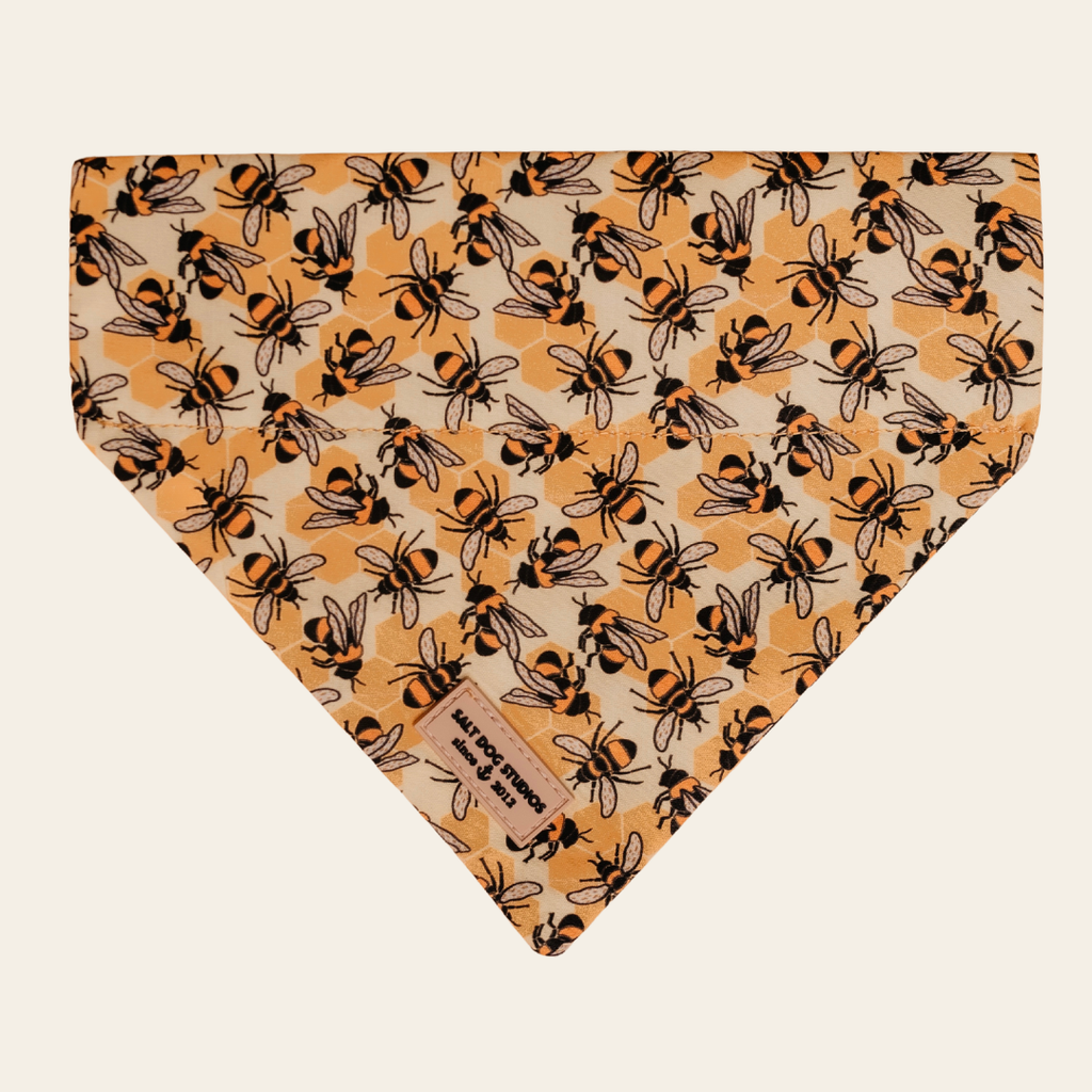 Honey Bee Hive dog bandana with black bees on yellow, shown flat