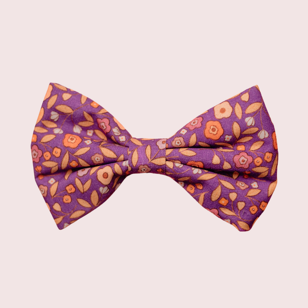 Ditsy Floral Purple dog bow tie with small flowers on purple, front view