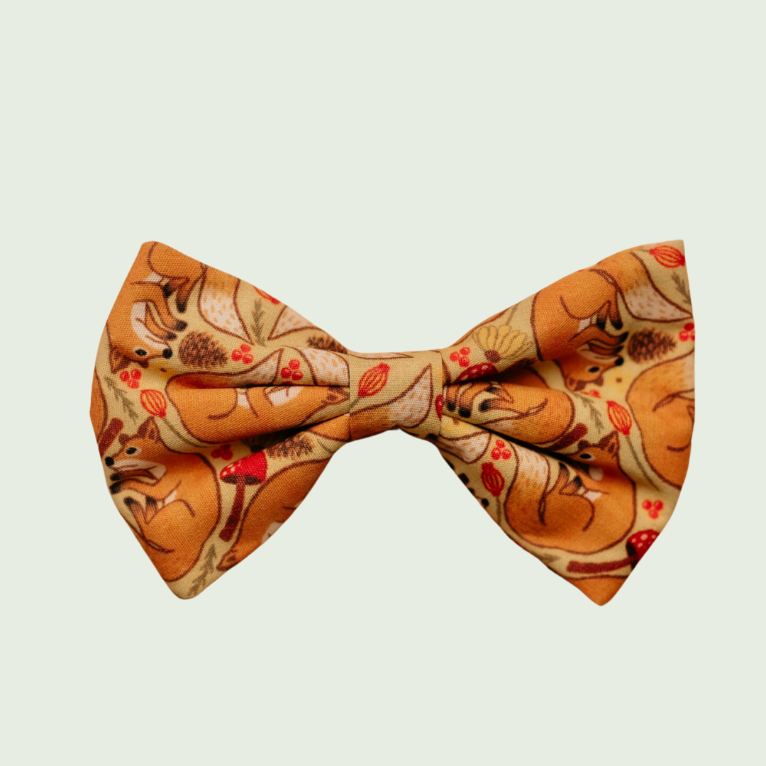 Fantastic Fox dog bow tie with orange fox and fern print, front view