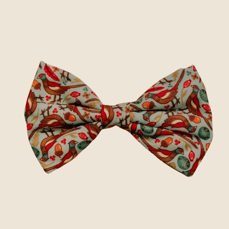 Pheasants dog bow tie with red and green pheasant print, front view