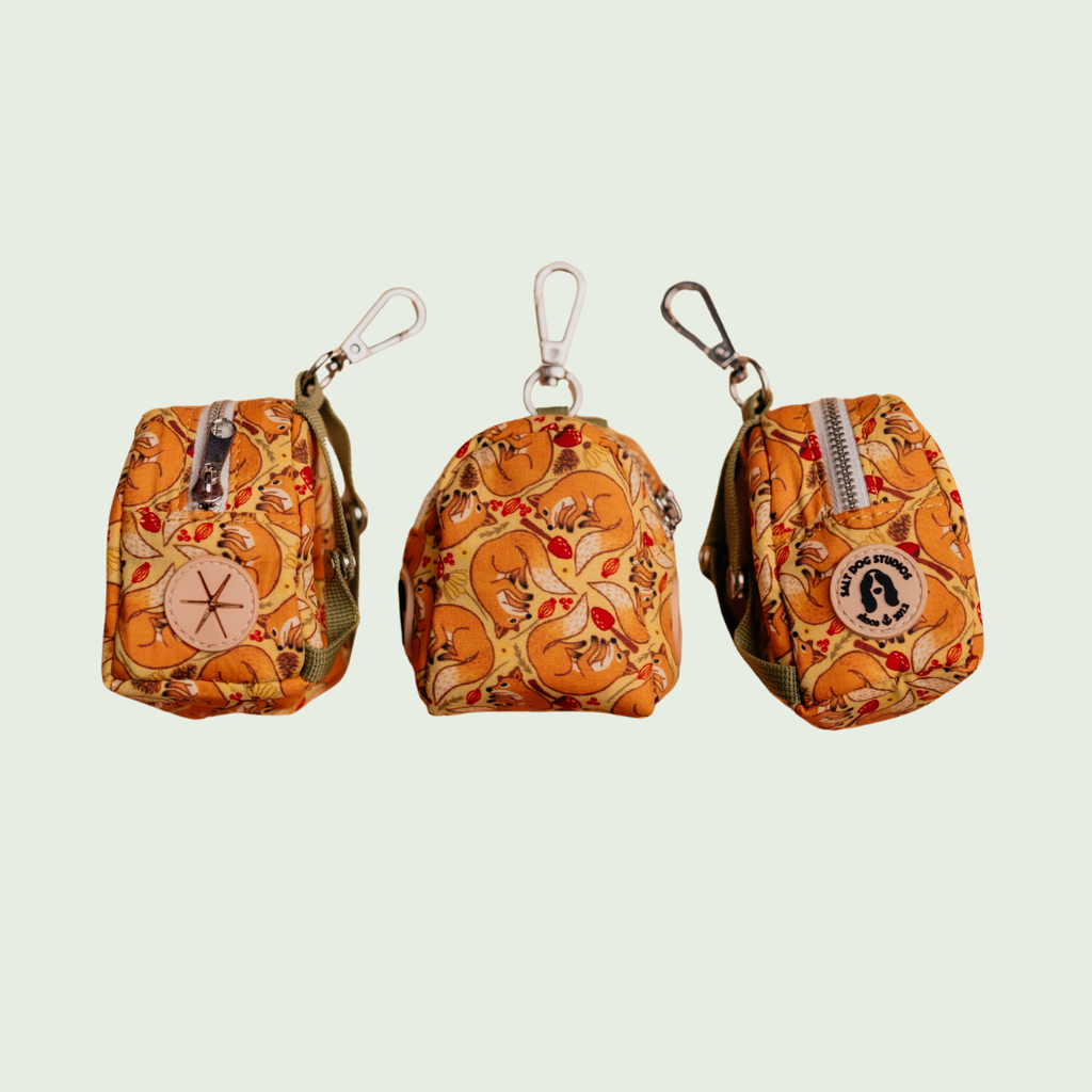 Fantastic Fox dog poo bag holder with orange fox and fern print, shown from three angles