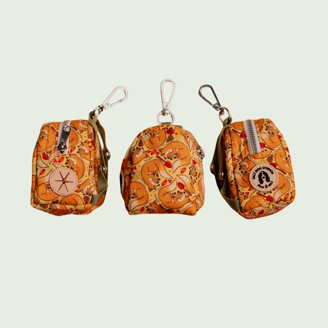 Fantastic Fox dog poo bag holder with orange fox and fern print, shown from three angles