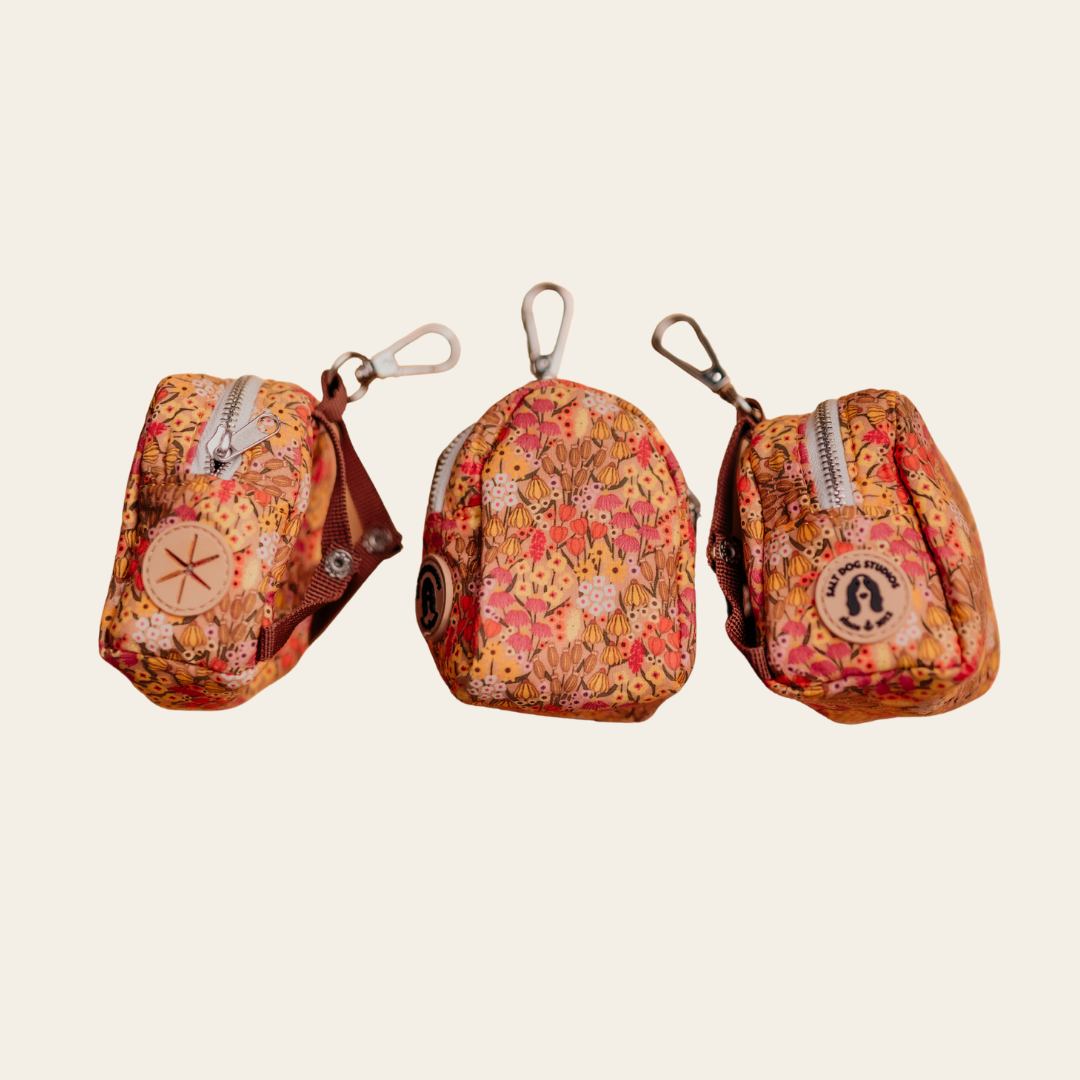 Wildflower Meadow dog poo bag holder with pink and gold floral print, shown from three angles