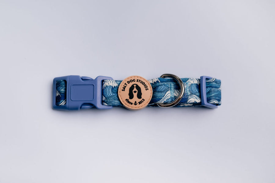 Catching Waves Dog Collar by Salt Dog Studios featuring blue nautical wave print fabric with velvet lining, sturdy clasp and rust-proof D-ring.
