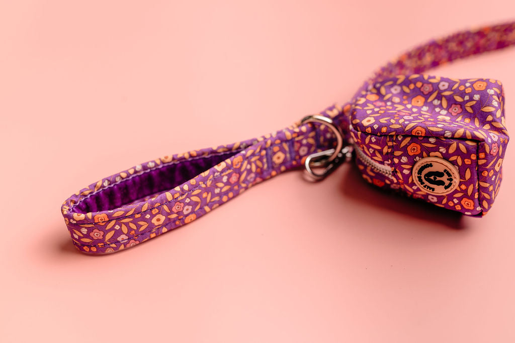 purple ditsy floral dog poo bag holder on lead